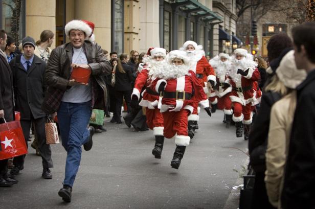 Fred being chased by Father Christmases